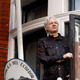 WikiLeaks founder Julian Assange greets supporters outside the Ecuadorian embassy in London on May 19, 2017.